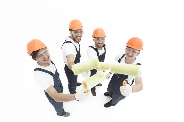 Vista do top.a grupo de decoradores com um rolo de pintura — Fotografia de Stock