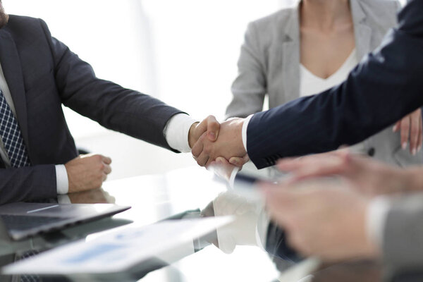 confident handshake of business partners