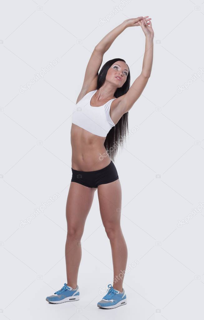 woman with arms raised, doing stretching exercises