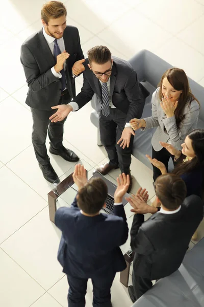 Positive colleagues giving high five