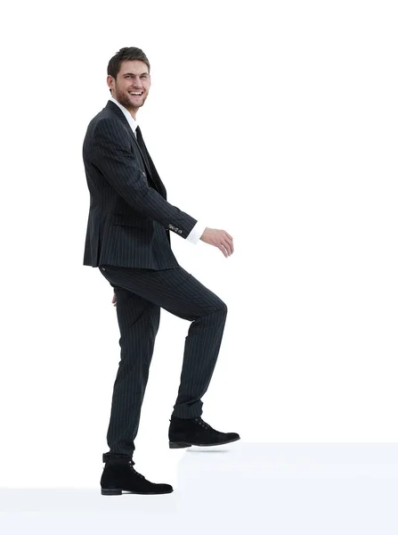 Full growth.businessman taking a step forward.isolated on white. — Stock Photo, Image