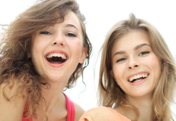 Closeup of three young people smiling on white background — Stock Photo, Image