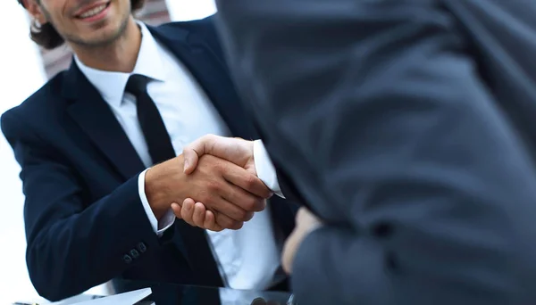 Handshake business partners in front of the open laptop — Stock Photo, Image
