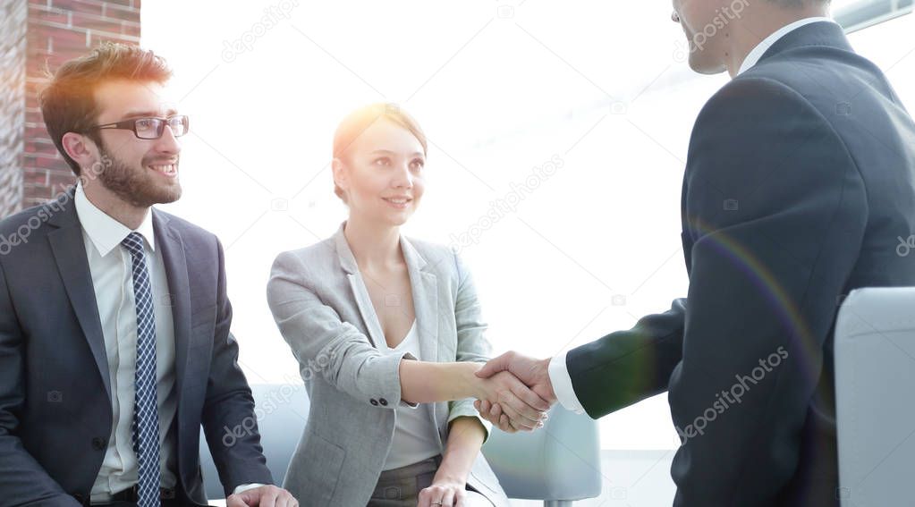 confident handshake business partners