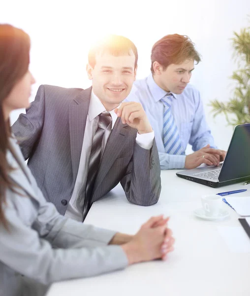 Manager and colleagues in the workplace — Stock Photo, Image