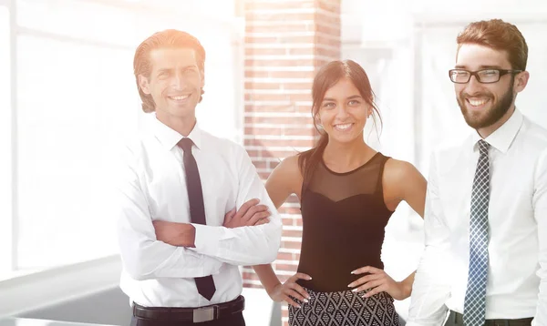 Confident business colleagues in the background of the office — Stock Photo, Image