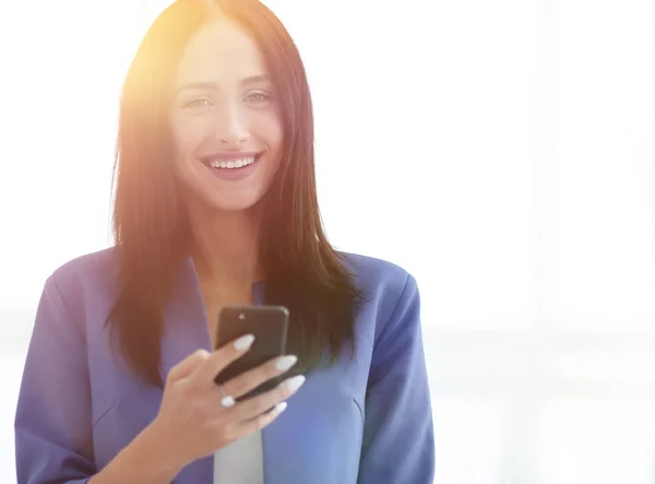 Young businesswoman with mobilephone