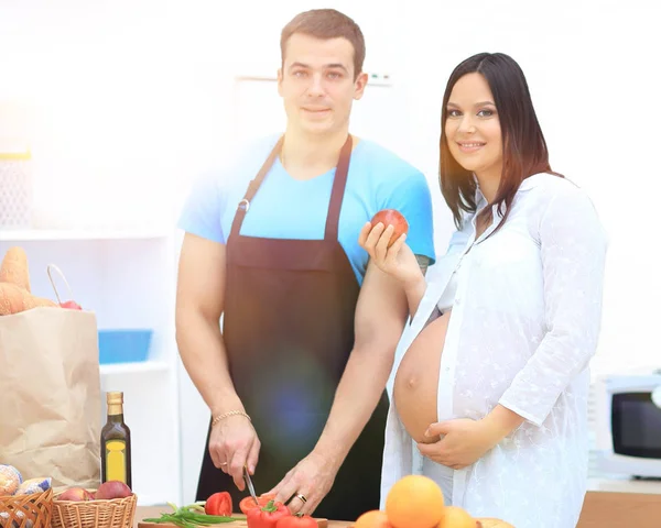 Happy husband makes Breakfast for his pregnant wife. — Stock Photo, Image