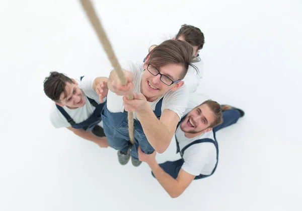 View from the top.young worker climbing up the rope — Stock Photo, Image