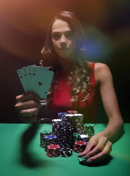 Beautiful woman with casino chips a black — Stock Photo, Image