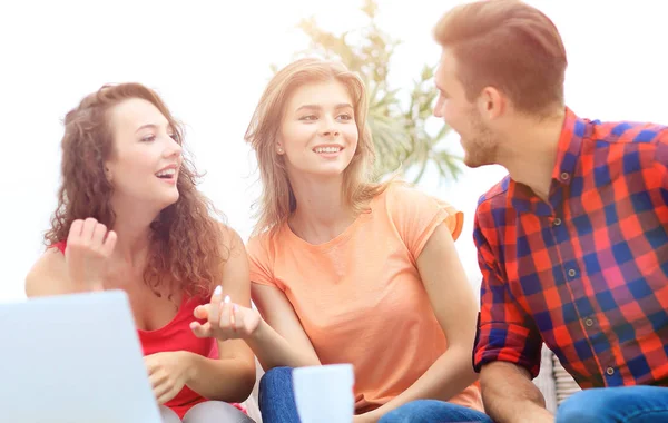 Group of students to discuss the problem sitting on the couch. — Stock Photo, Image