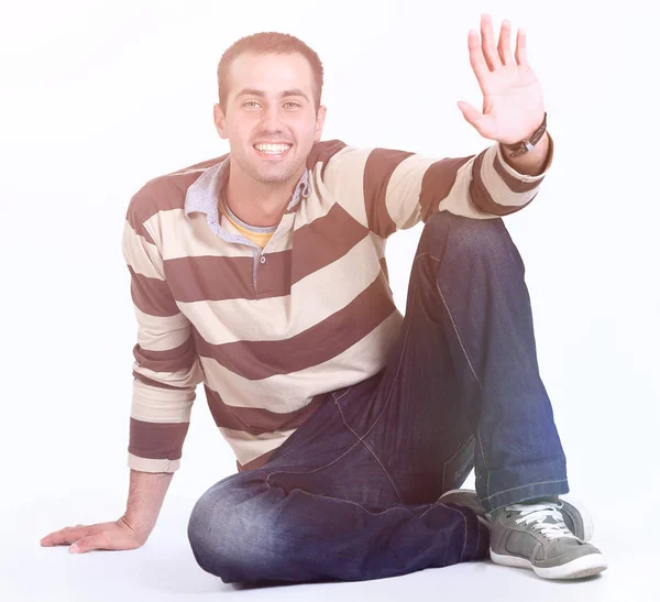 Modern young man sitting on the floor — Stock Photo, Image