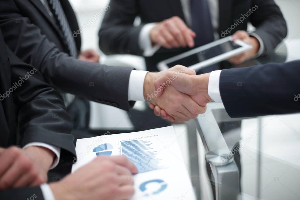 Business handshake. Close-up of business men shaking hands.