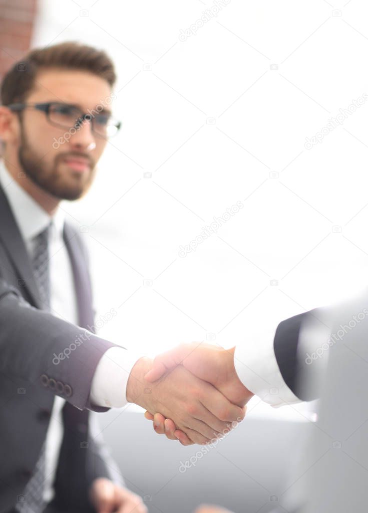 businessman shaking hands in office