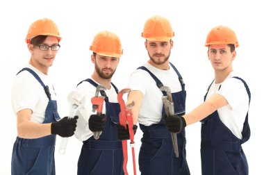 Tesisatçılar çalışma araçları ile grup