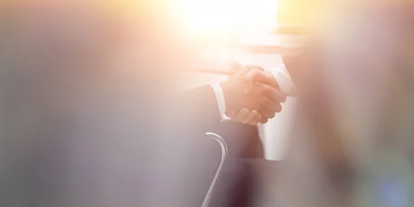 Handshake of business partners on blurred background — Stock Photo, Image