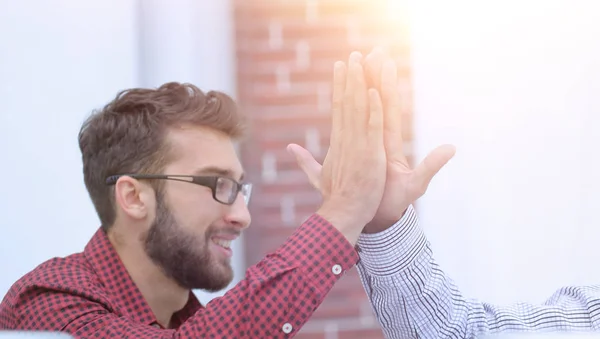 Closeup.colleagues giving each other high five — Stock Photo, Image
