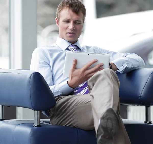 Businessman in suit resting in armchair at office — Stock Photo, Image