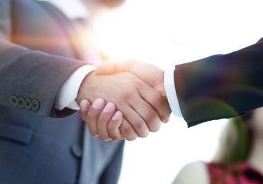 Successful business people handshaking after good deal. clipart