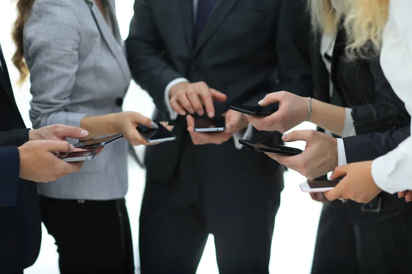 Closeup.business team using smartphones . — Stock Photo, Image