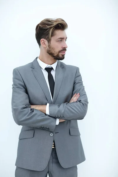 Homem de negócios com braços cruzados em um fundo branco — Fotografia de Stock