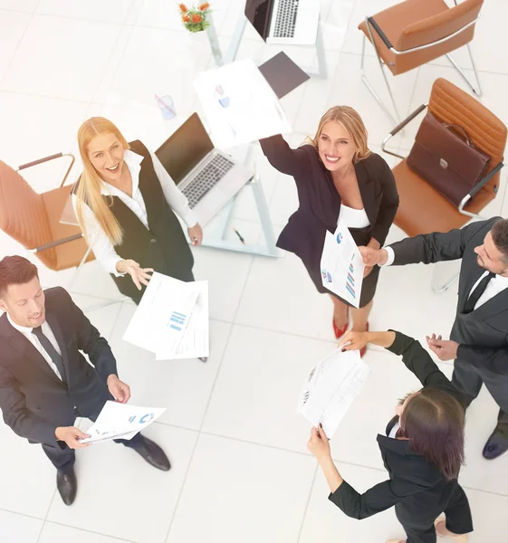 View from the top.business team throwing work documents.t — Stock Photo, Image