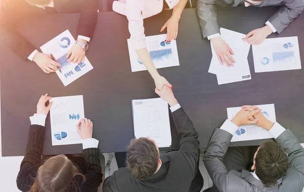 Handshake business partners after the conclusion of the financial transaction — Stock Photo, Image