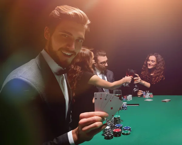 Lucky man with the winning combination of cards — Stock Photo, Image