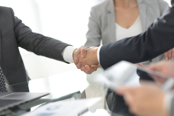 confident handshake of business partners