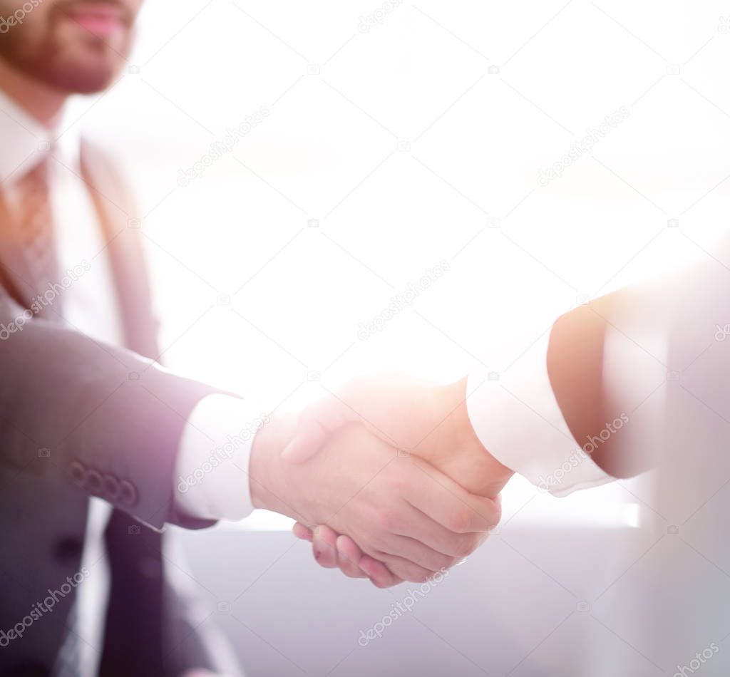 businessman shaking hands in office