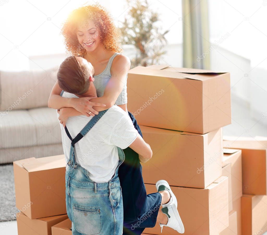 Portrait of a young couple moving into a new home