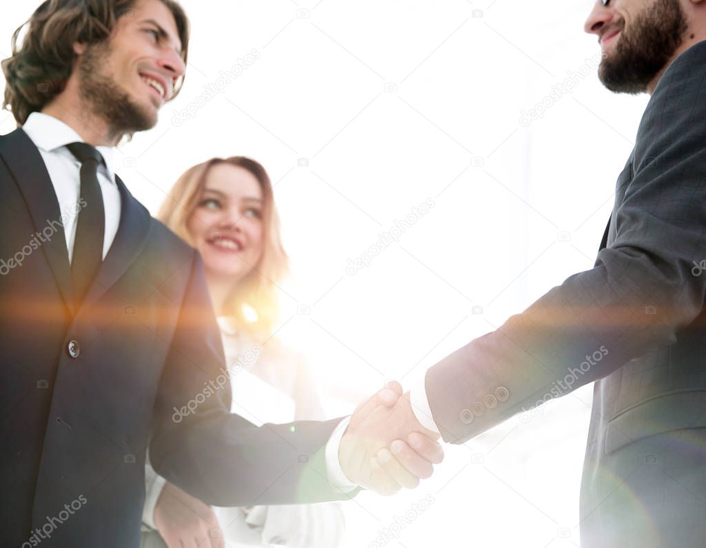 Photo of handshake of two happy businessmen