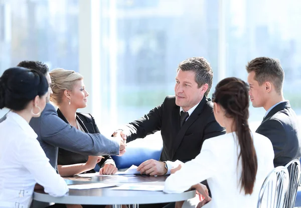 Two business partners shaking hands on meeting — Stock Photo, Image