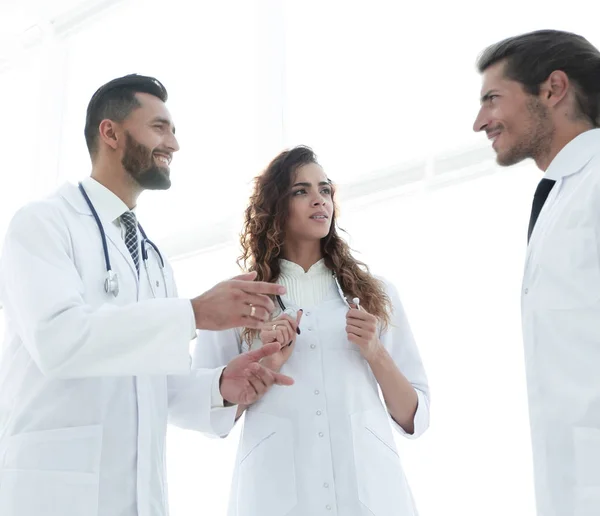 group of doctors discussing in hospital.