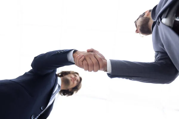 Bottom view of two men shaking hands while standing — Stock Photo, Image