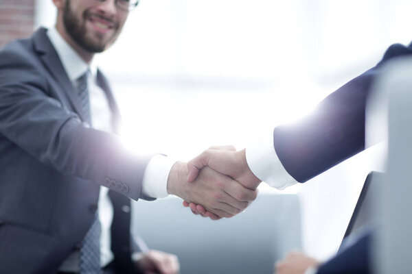Close up of business handshake in the office