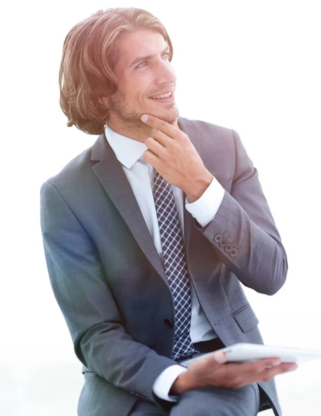 Modern businessman with tablet looking at copy space — Stock Photo, Image