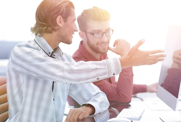 Business colleagues sitting at a Desk. — Stock Photo, Image