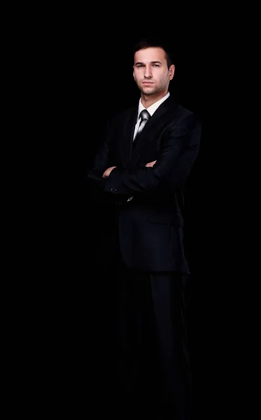 Портрет уверенного бизнесмена, изолированного на черном — стоковое фото
