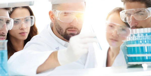 Close seup of a doctor-pharmacists and colleagues working in the la — стоковое фото