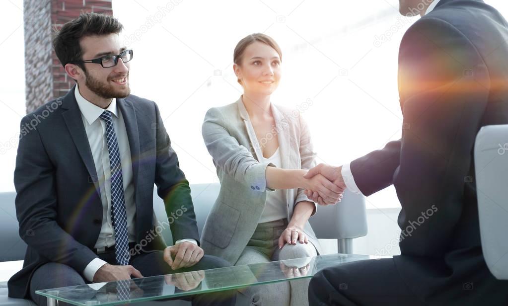 confident handshake business partners