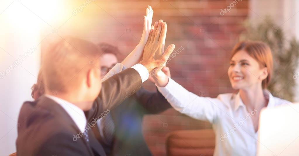 successful business team giving each other a high five