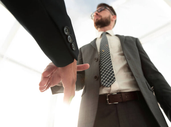 Two  business men going to make handshake