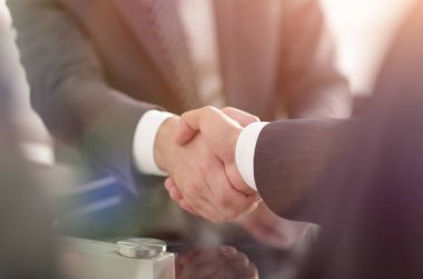 confident handshake of business partners clipart