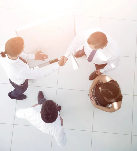 View from the top.the handshake of colleagues before the present — Stock Photo, Image