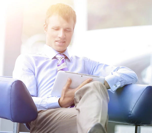 Businessman in suit resting in armchair at office — Stock Photo, Image