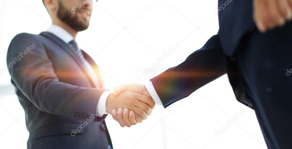 Businessmen making handshake - business etiquette, congratulatio