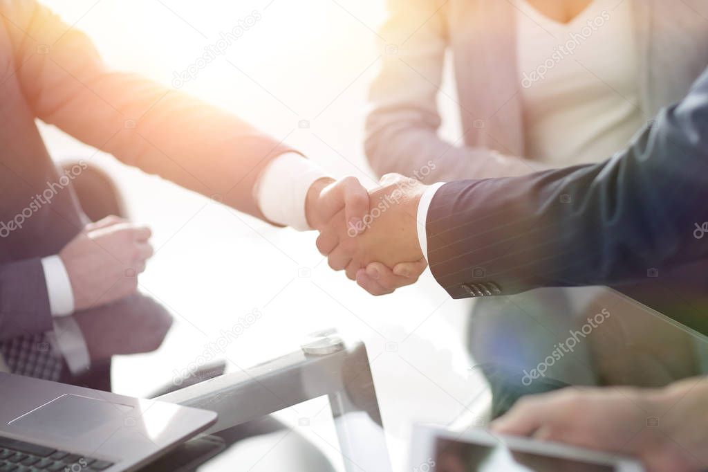 confident handshake of business partners