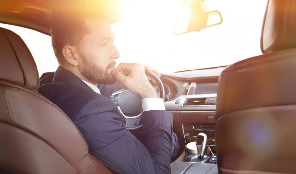 Confident businessman in his car. — Stock Photo, Image