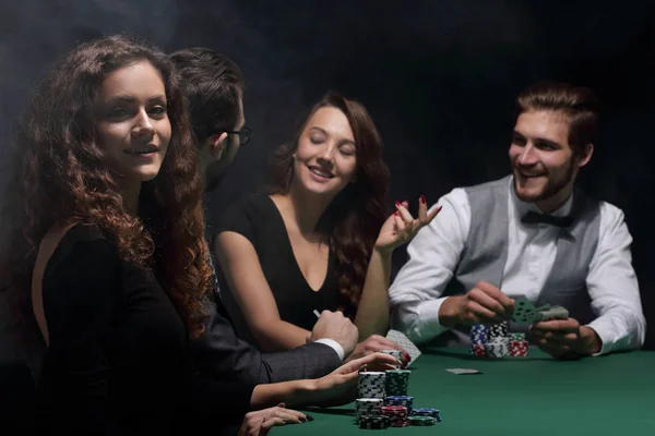 Closeup.poker players sitting at a casino table Royalty Free Stock Photos